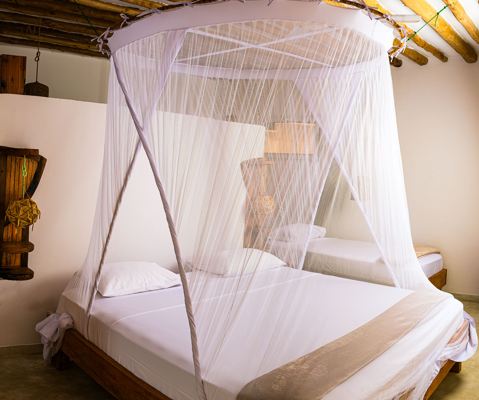Triple Suite - king bed with mosquito net